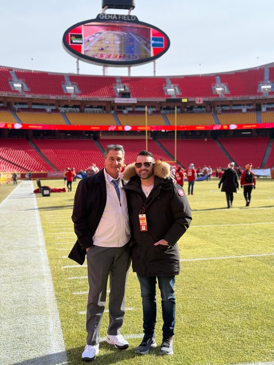 Gene with his dad on the field at Arrowhead Stadium